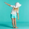 Chapeau Anti UV Bébé Réversible Rose Clair Et Imprimé Fleurs -Magasin De Surf chapeau anti uv bebe reversible rose clair et imprime fleurs